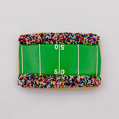 custom football field decorated sugar cookie from southern home bakery in orlando, florida
