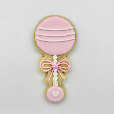 Custom decorated baby rattle sugar cookie by Southern Home Bakery in Orlando, Florida