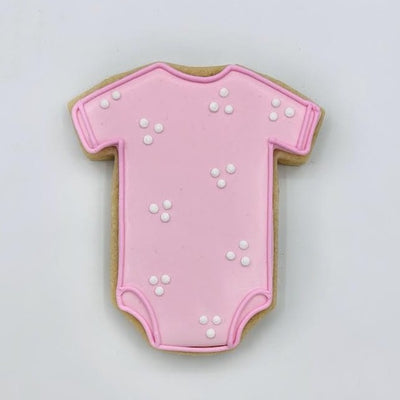 pink onesie decorated sugar cookie from southern home bakery in orlando, florida