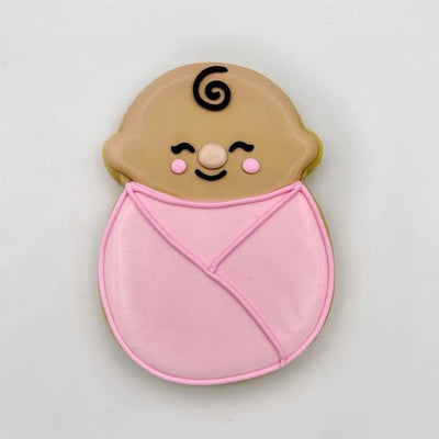 swaddled baby decorated sugar cookie from southern home bakery in orlando, florida