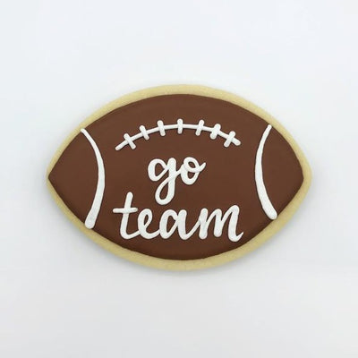 Custom decorated football with text sugar cookie by Southern Home Bakery in Orlando, Florida