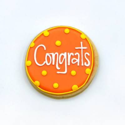Custom decorated "congrats" circle sugar cookie by Southern Home Bakery in Orlando, Florida